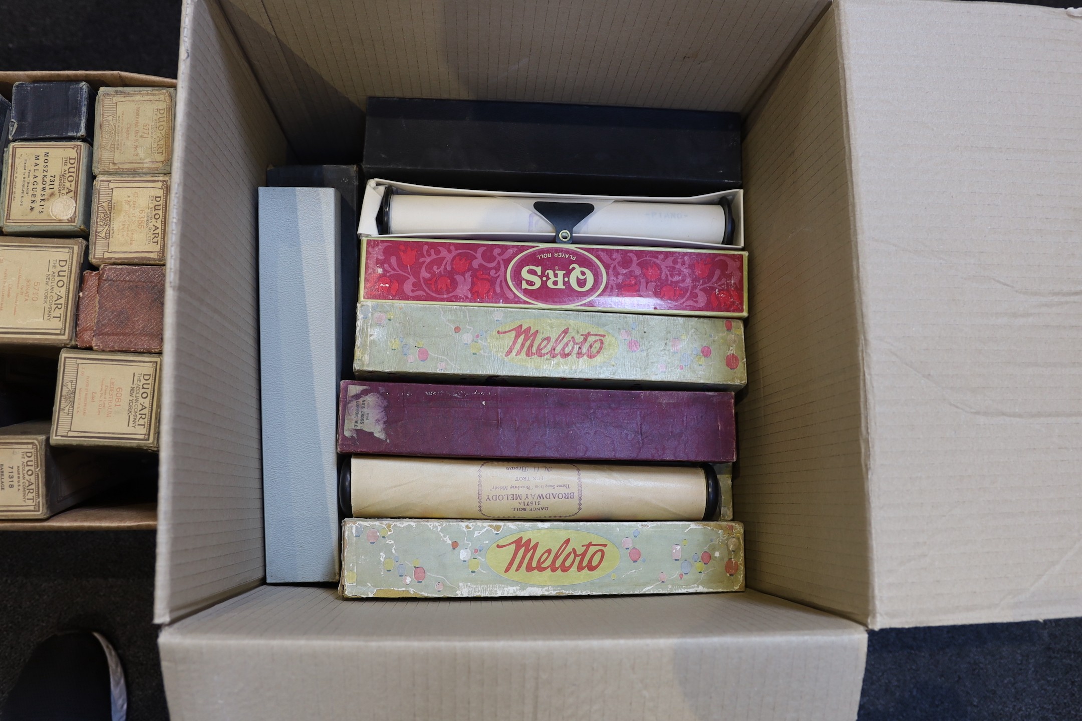 A collection of approximately 75 boxed pianola rolls mainly Duo-Art and Meloto.